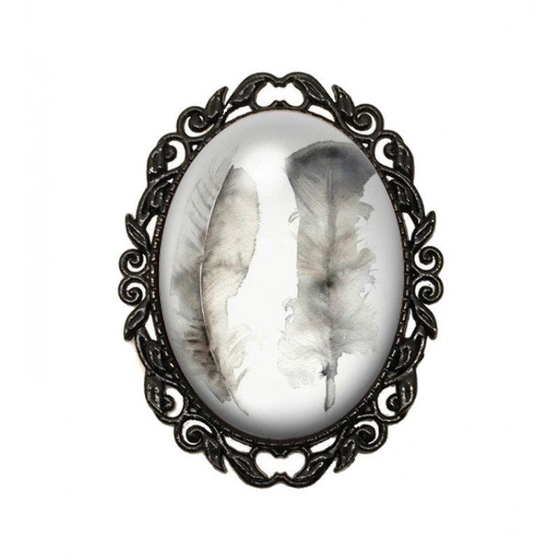 Broche Noire avec Cabochon en Verre Plumes