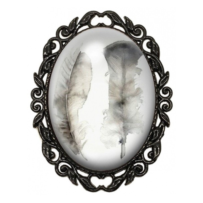 Broche Noire avec Cabochon en Verre Plumes Blanches